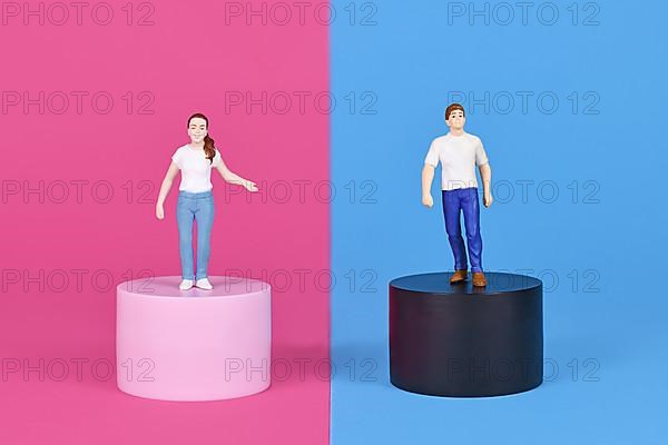 Concept for pink and blue gender stereotypes with man and woman figure on different colored backgrounds