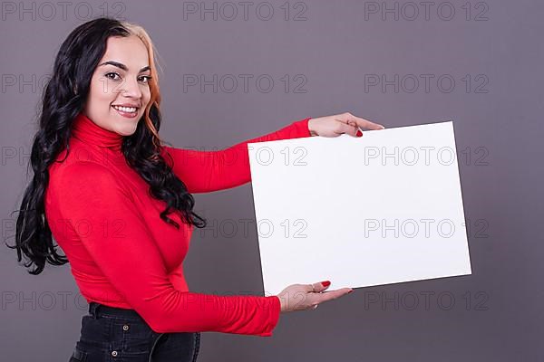 Beautiful woman holding a blank sign