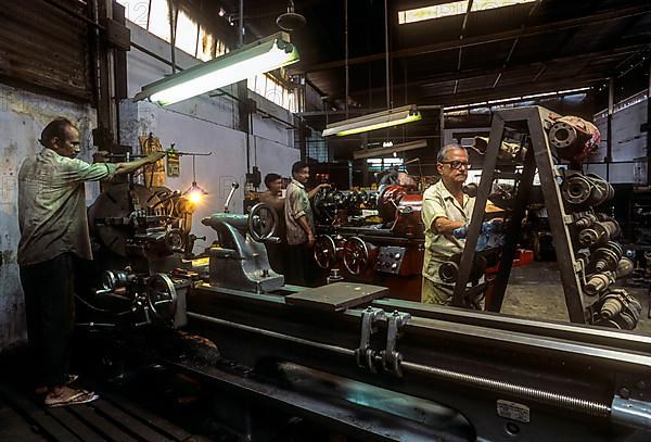 Machinist using metal lathe at Coimbatore