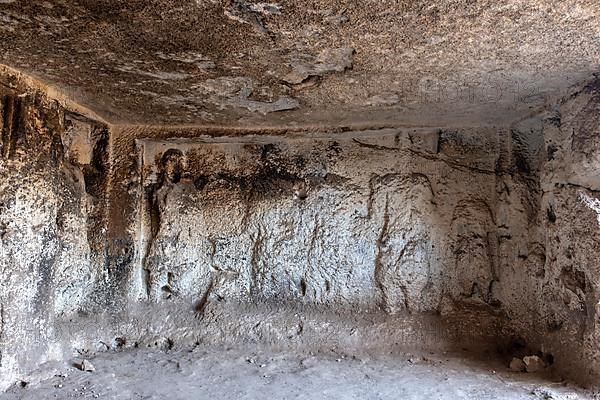 Views of the underground chamber located below the temple of Sin and containing bas-relief representations of the Syrian Gods amidst representations of the lunar crescent in Sogmatar