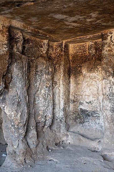 Views of the underground chamber located below the temple of Sin and containing bas-relief representations of the Syrian Gods amidst representations of the lunar crescent in Sogmatar