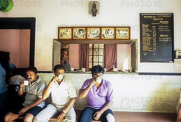 People drinking coffee in the famous Mavalli Tiffin Rooms in Bengaluru Bangalore