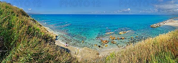 Beach with turquoise sea at the Grotte Piedigrotta