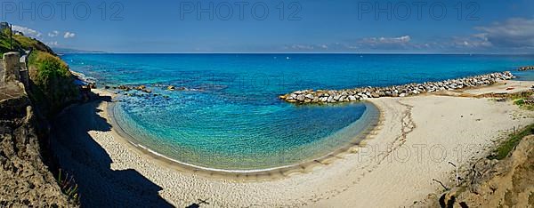 Sandy beach beach with turquoise sea at the Grotte Piedigrotta