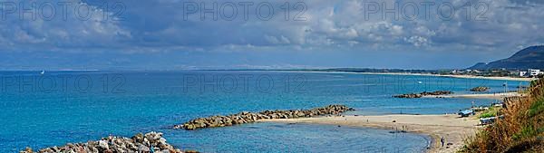 Sandy beach beach with turquoise sea at the Grotte Piedigrotta