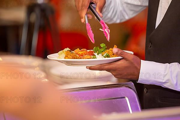 Serving freshly homemade curry of pumpkin