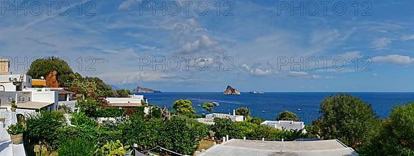 Town of Panarea overlooking the small island of Le Guglie and di Basiluzzo of a former volcano