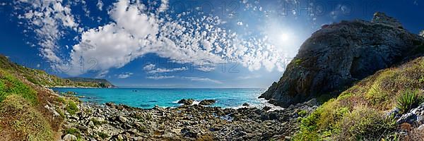 Bay Capo Vaticano with turquoise sea and bizarre sky