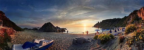 Panorama on the sandy beach and bay Capo Vaticano at sunset