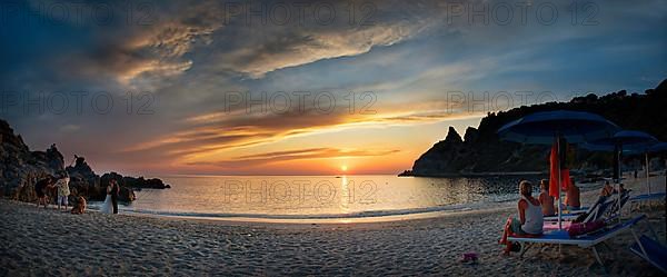 Panorama on the sandy beach and bay Capo Vaticano at sunset