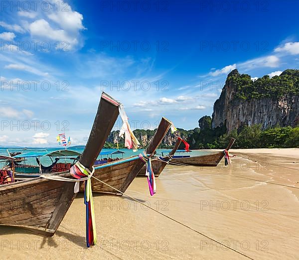 Long tail boats on tropical beach