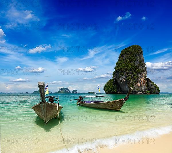 Long tail boats on tropical beach