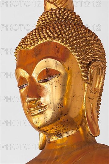 Golden Buddha Statue headclose up in Wat Pho Buddhist Temple