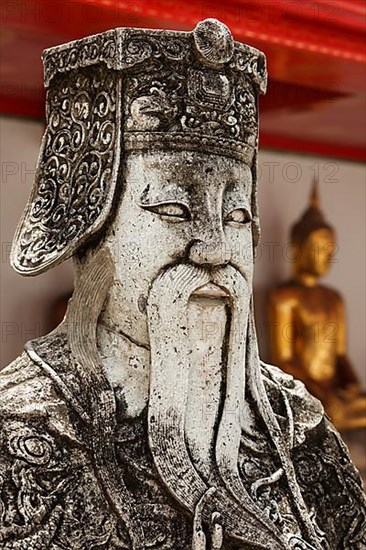 Wat Pho Chinese stone guardian face close up