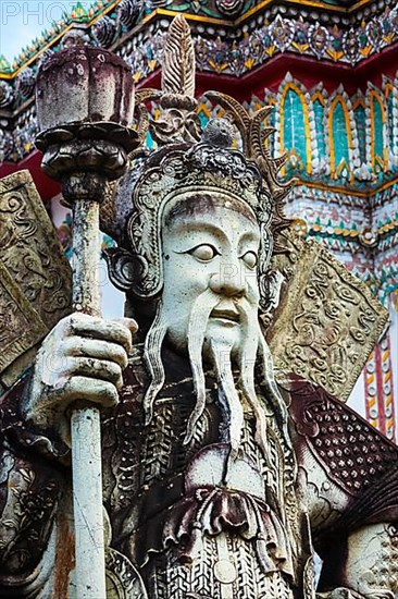Chinese stone guardian statue close up in Wat Pho Buddhist Temple