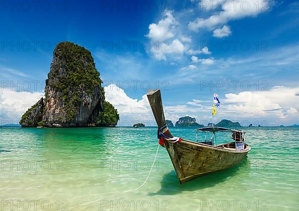 Long tail boat on tropical beach