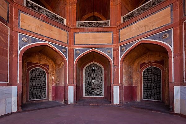 Arch with carved marble window. Mughal style. Humayun's tomb