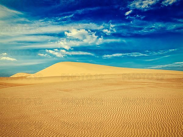 Vintage retro effect filtered hipster style image of white sand dunes on sunrise