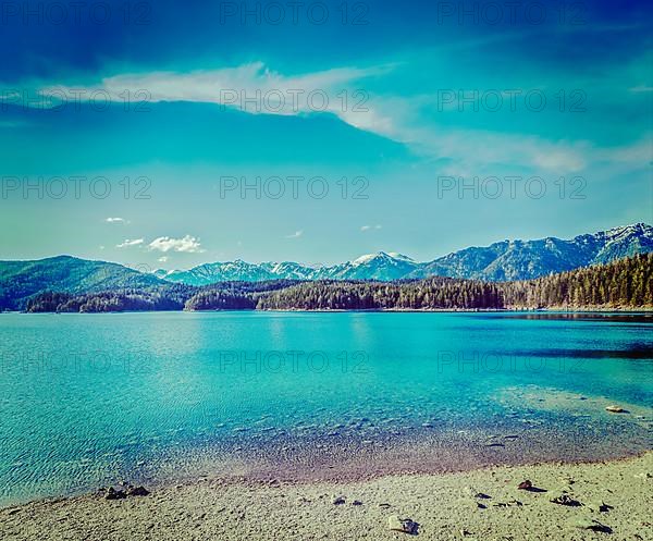 Vintage retro hipster style travel image of Eibsee lake. Bavaria