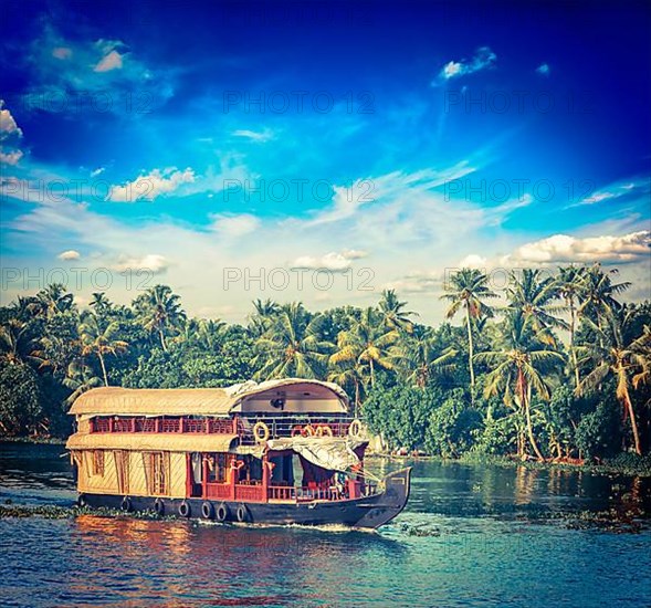 Vintage retro hipster style travel image of Kerala travel tourism background