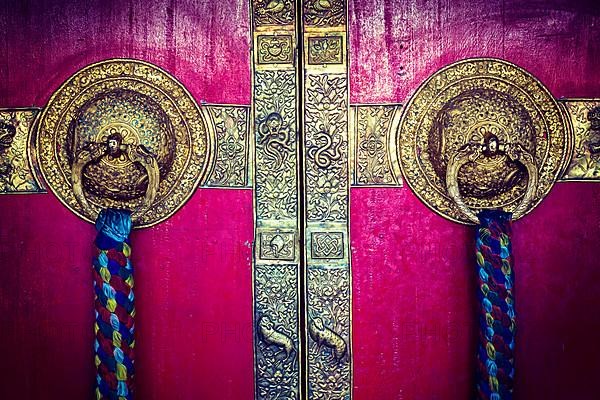 Vintage retro hipster style travel image of door handles on gates of Ki monastry. Spiti Valley