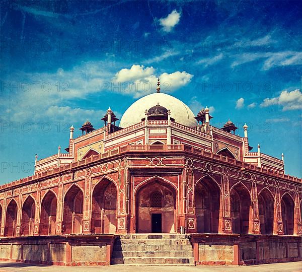 Vintage retro hipster style travel image of Humayun's Tomb with overlaid grunge texture. Delhi