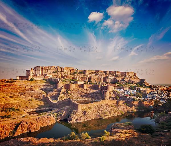 Retro vintage hipster style image of Mehrangarh Fort and Padamsar Talab and Ranisar Talab lakes on sunset