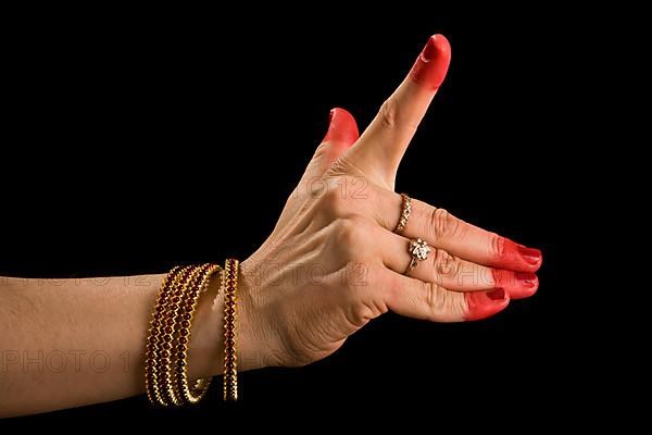 Woman hand showing Pralambha hasta of indian classic dance Bharata Natyam