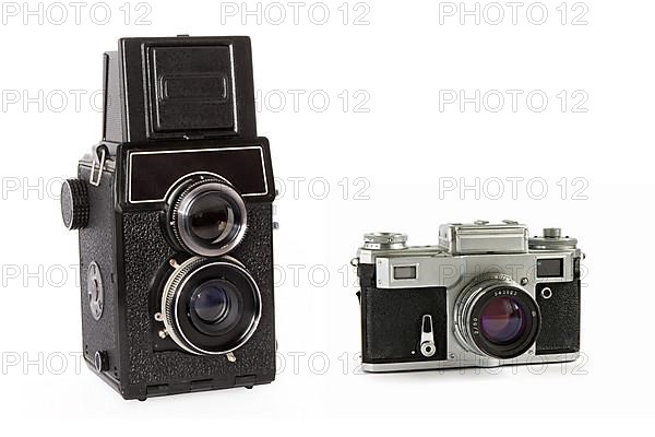 Old rangefinder and twin-lens reflex large format film cameras isolated on white background