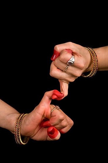 Woman hand showing Kilaka hasta of indian classic dance Bharata Natyam