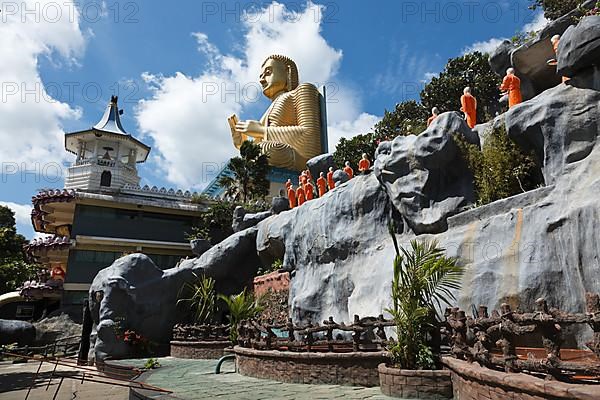 Buddhist monk statues going to Gold Buddha temple