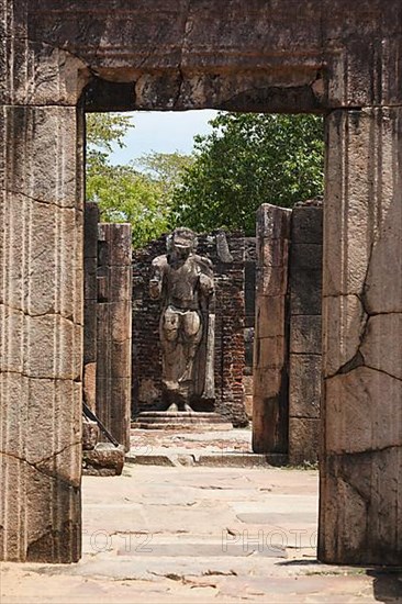 Passage in ruins to Buddha statue. Pollonaruwa