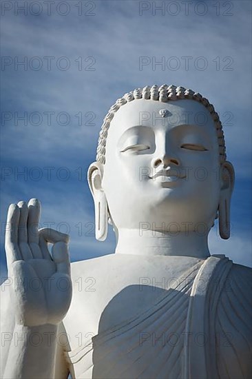 Closse up of white Buddha statue. Mihintale