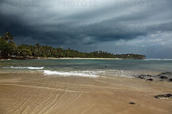 Beach and gathering storm. Mirirssa