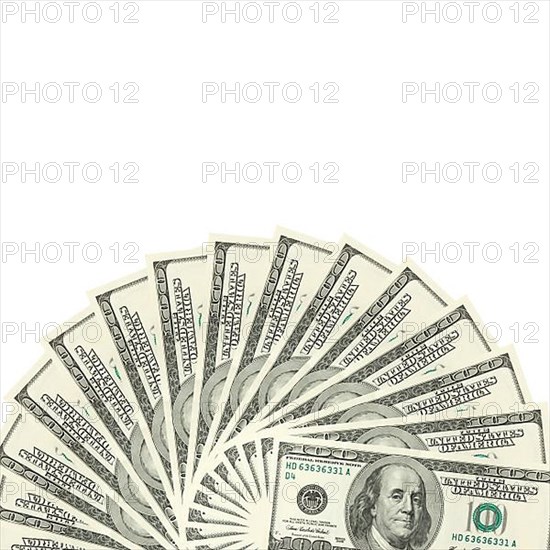 Hundreds of dollars spread on white background