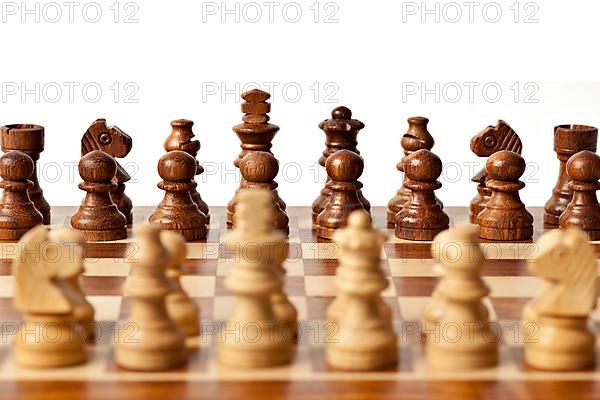 Wooden chess pieces on chessboard. Selective focus