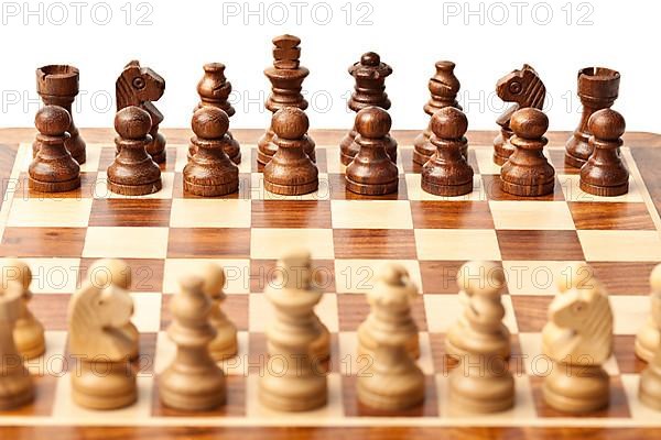 Wooden chess pieces on chessboard. Selective focus