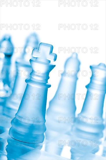 Glass chess on chess board