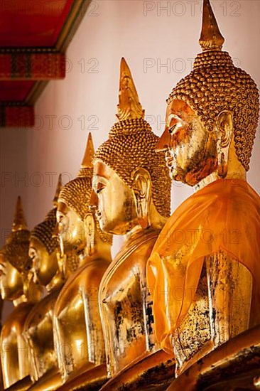 Sitting Buddha statues close up. Wat Pho temple