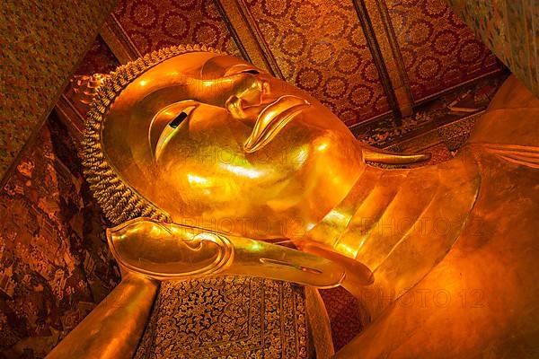 Reclining Buddha gold statue face. Wat Pho