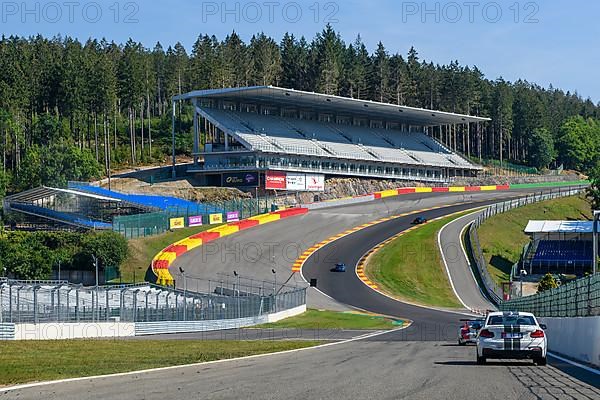 View from the perspective of a racing driver in front of overtaking in the dangerous Eau Rouge bend