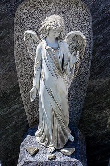 Ceramic angel as grave decoration