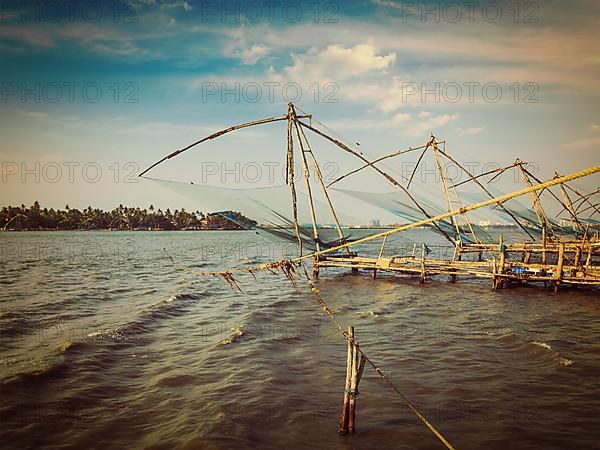 Vintage retro effect filtered hipster style image of Kochi chinese fishnets on sunset. Fort Kochin