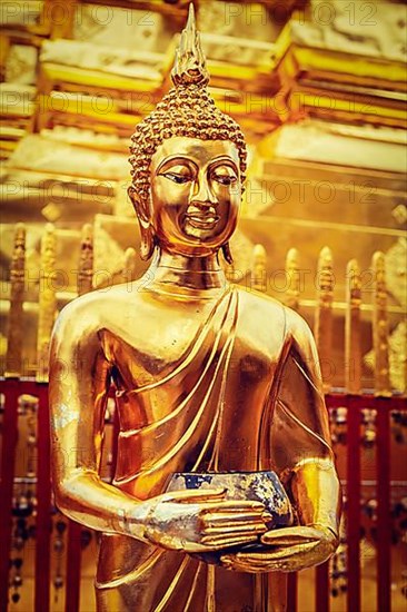 Vintage retro effect filtered hipster style image of gold Buddha statue in Wat Phra That Doi Suthep