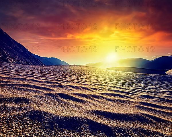 Vintage retro effect filtered hipster style image of sand dunes in Himalayas on sunset. Hunder