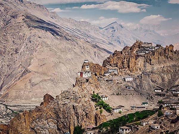 Vintage retro effect filtered hipster style image of Dhankar gompa Buddhist monastery on cliff and Dhankar village in Himalayas