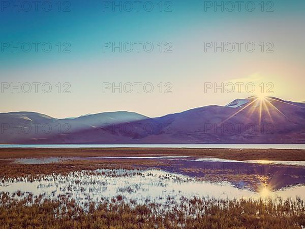 Vintage retro effect filtered hipster style image of Lake Tso Moriri in Himalayas on sunrise. Ladakh