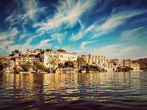 Vintage retro effect filtered hipster style image of City Palace view from the lake. Udaipur