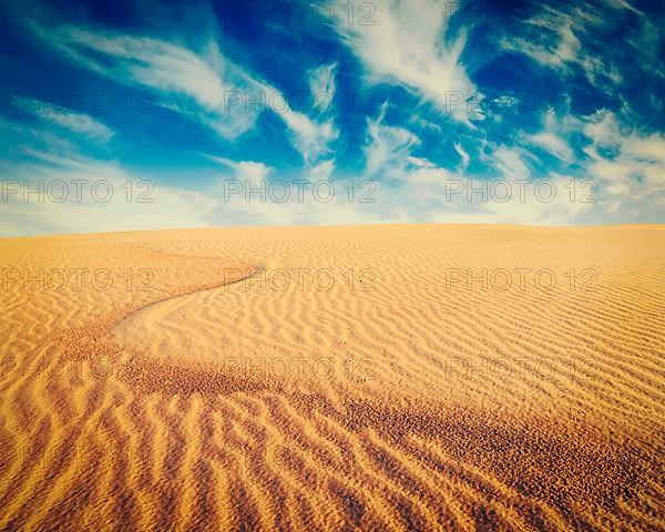 Vintage retro effect filtered hipster style image of white sand dunes on sunrise