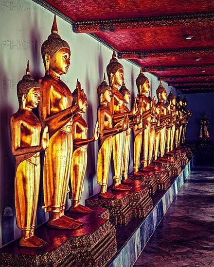 Vintage retro effect filtered hipster style image of sitting Buddha statues in Buddhist temple Wat Pho